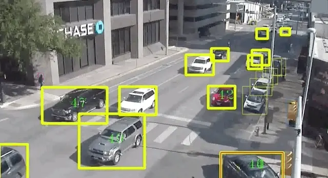 An AI overlay actively tracking vehicles on a busy road